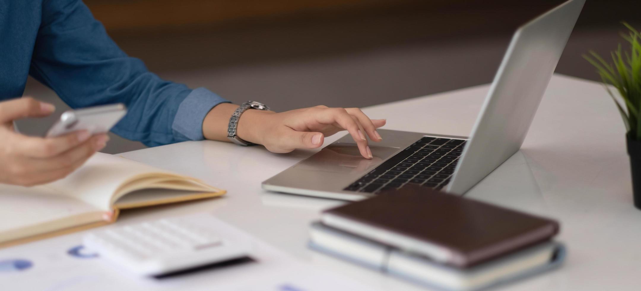 A businesswoman using an online banking program in order to open a digital savings account. The definition of cyber security. photo