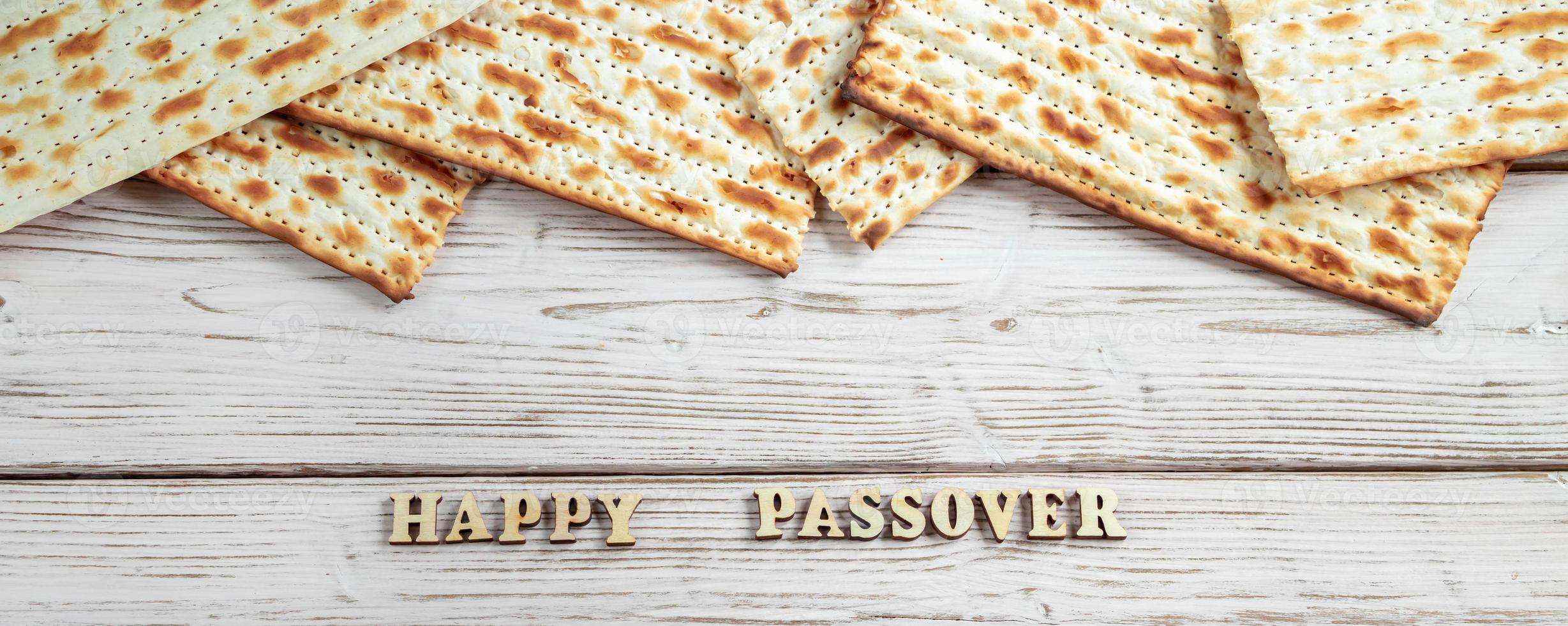 Concept of Jewish holiday Pesach. Passover. Traditional matzah on a white wooden background. photo