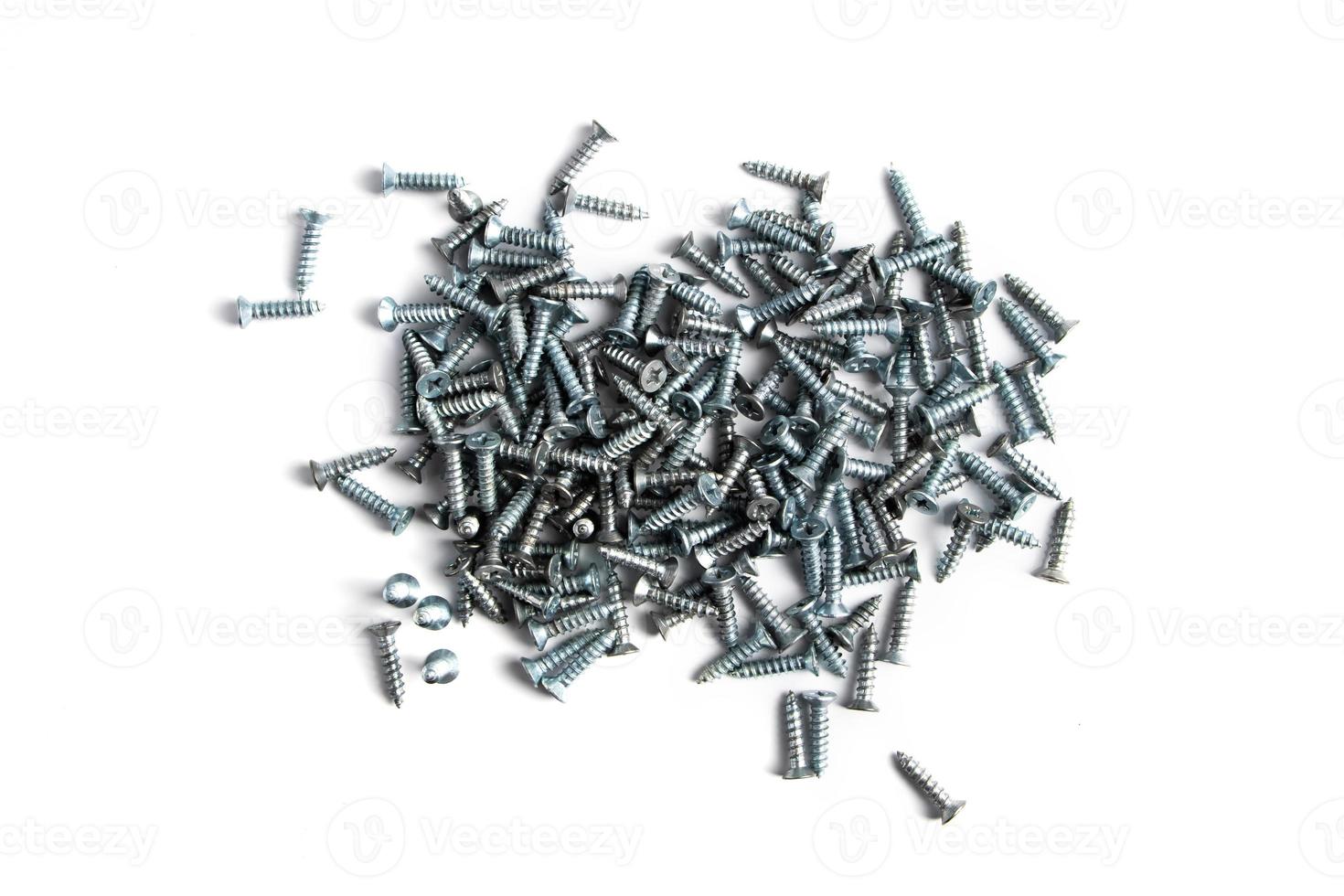 Metal screws on a white background. photo