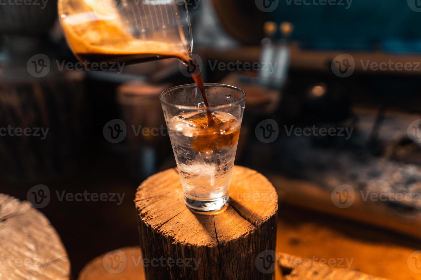 iced coffee in a glass making iced americano photo