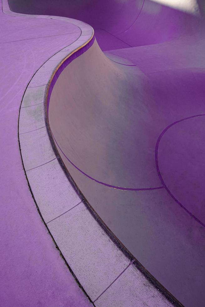 old purple skatepark on the street, skate court structure photo