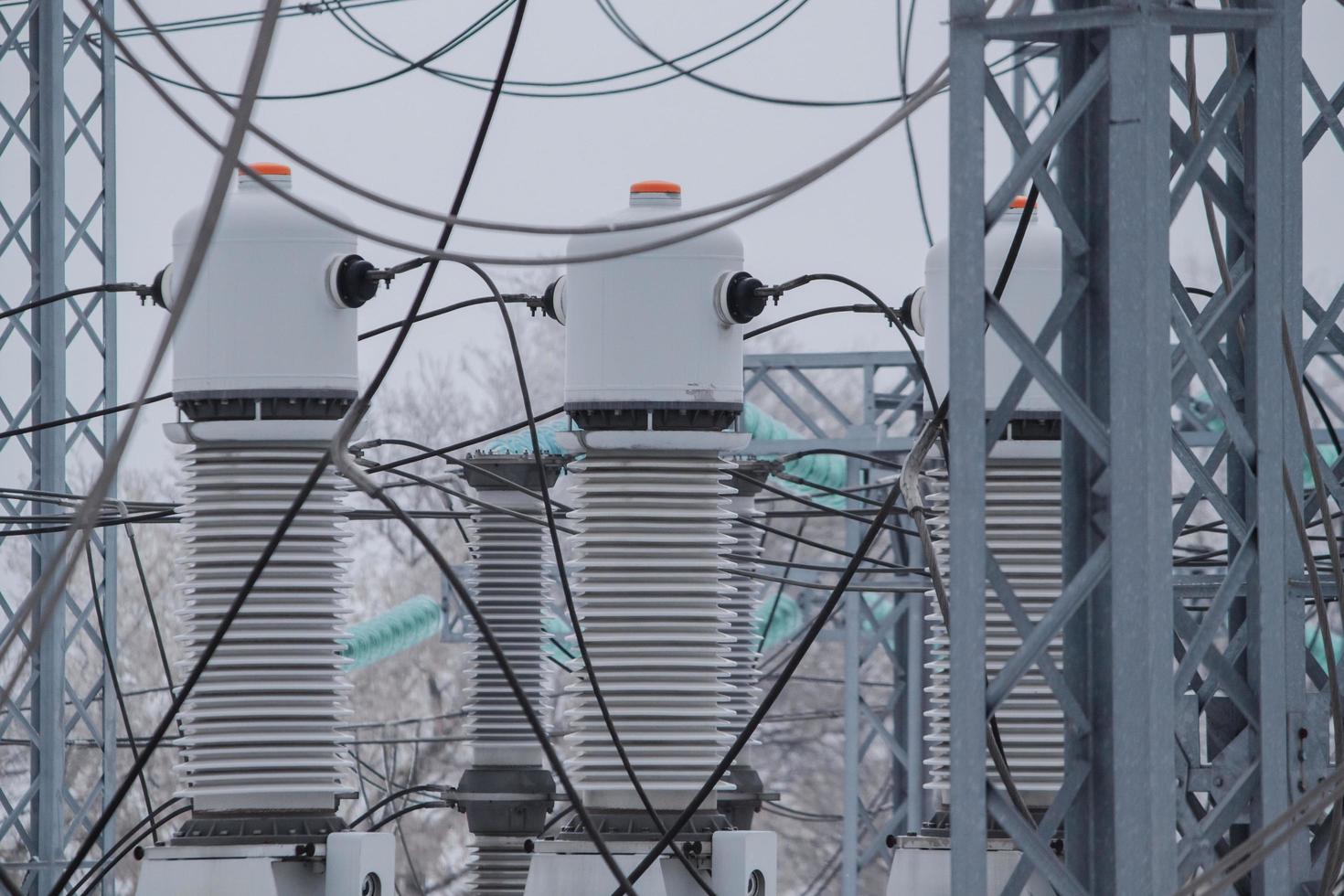 Measuring current transformers at a high-voltage substation. Electric power elements of urban infrastructure. photo