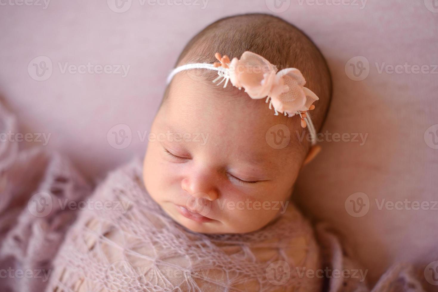 Close-up beautiful sleeping baby girl. Newborn baby girl, asleep photo