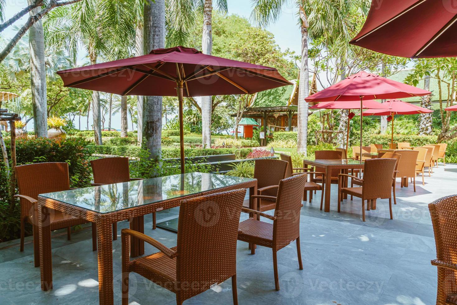 outdoor patio table and chair with umbrella photo