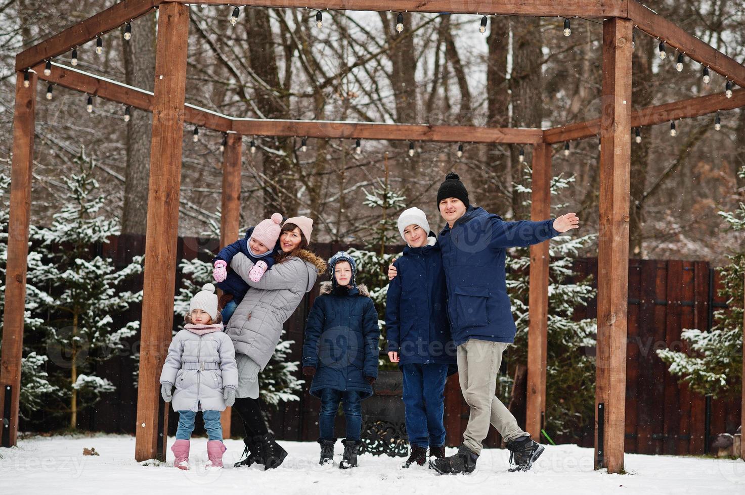 Big young family with four kids in winter day. photo