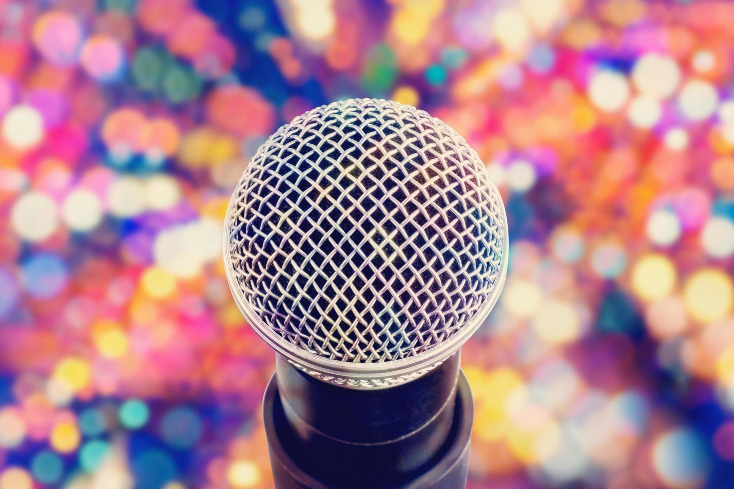 microphone head close-up on colorful bokeh background photo