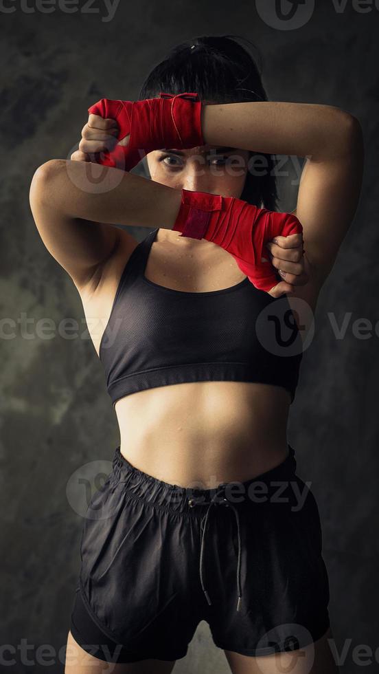 Wrapped in red cloth to make it ready to fight. Health care concept with exercise photo