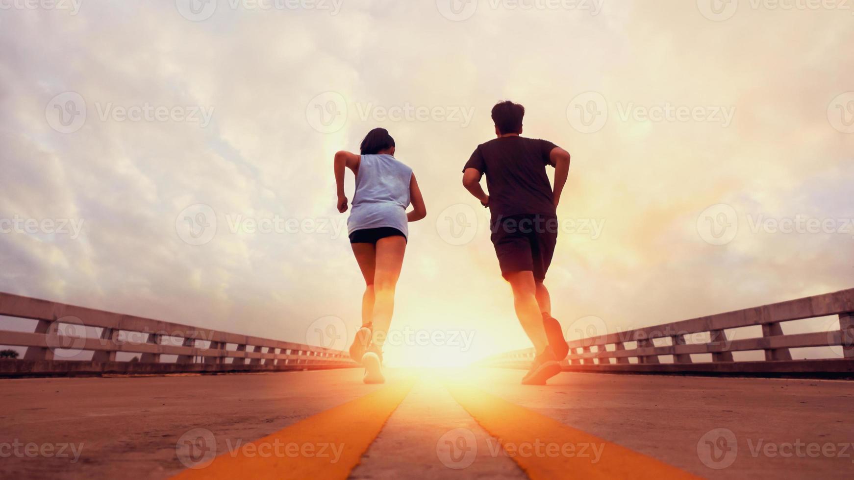 Two runners ran outside. And running on jogging roads. The concept of creating good health photo