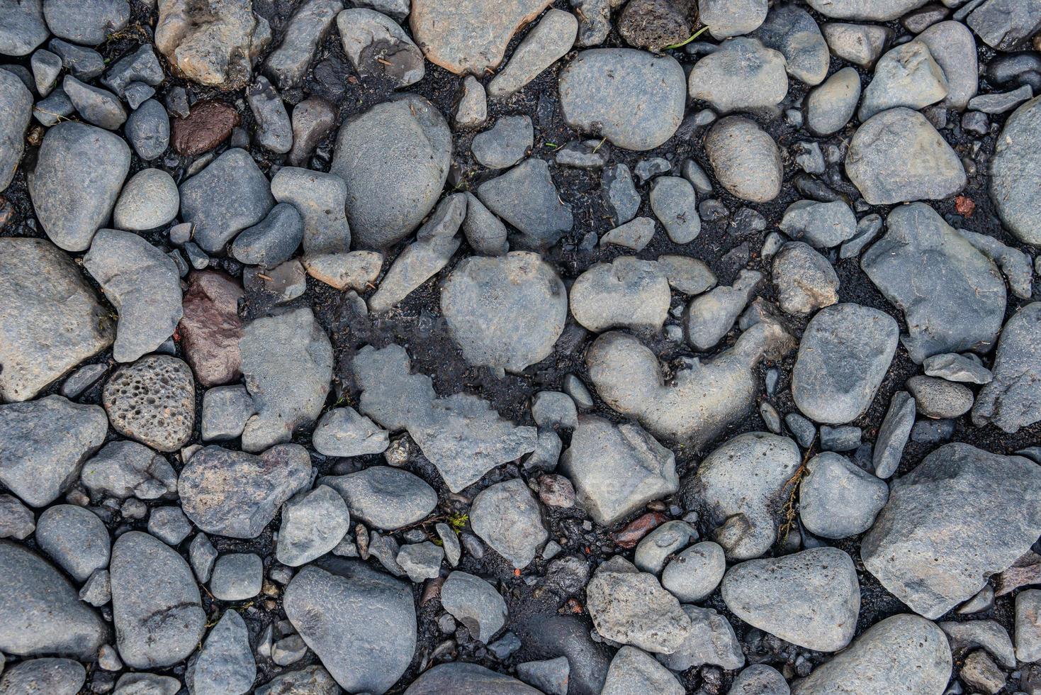 Round river pebbles as a background and texture, closeup, details. photo