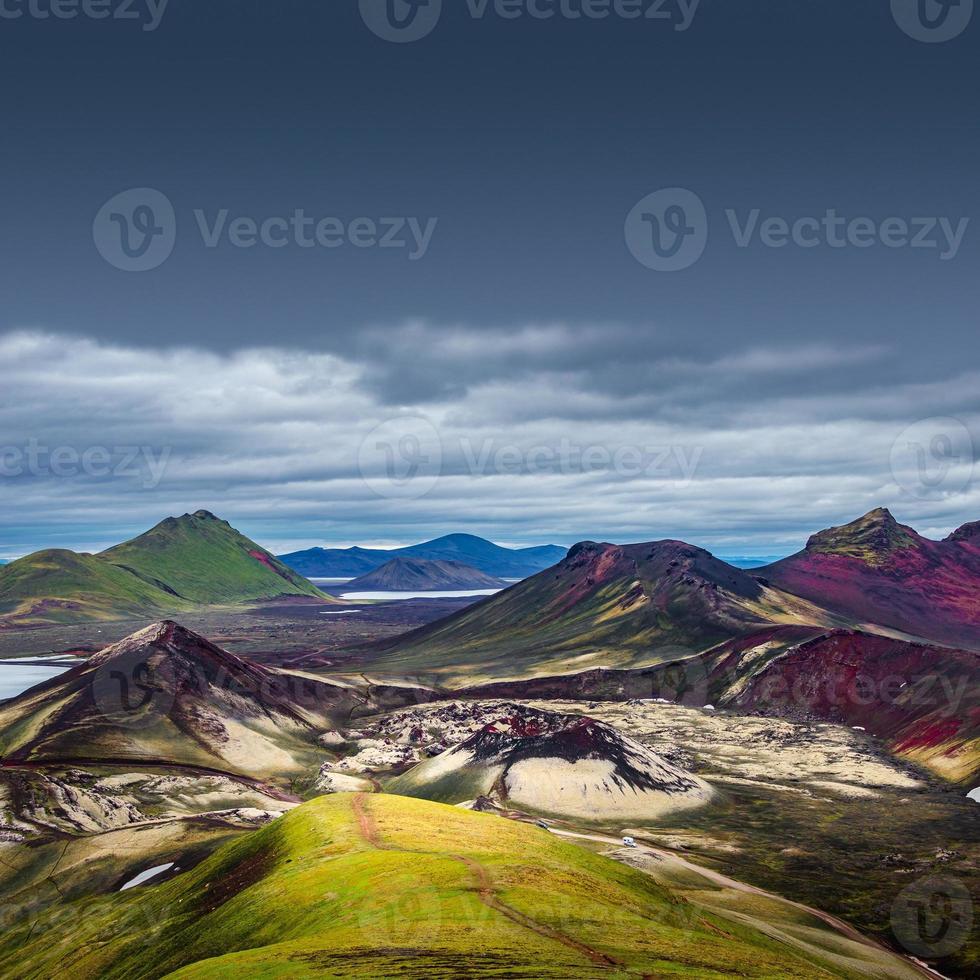 Cover page with colorful rhyolite volcanic mountains Landmannalaugar in Icelandic Highlands as pure wilderness in Iceland, Stutur volcano crater, summer time, dramatic scenic view. photo