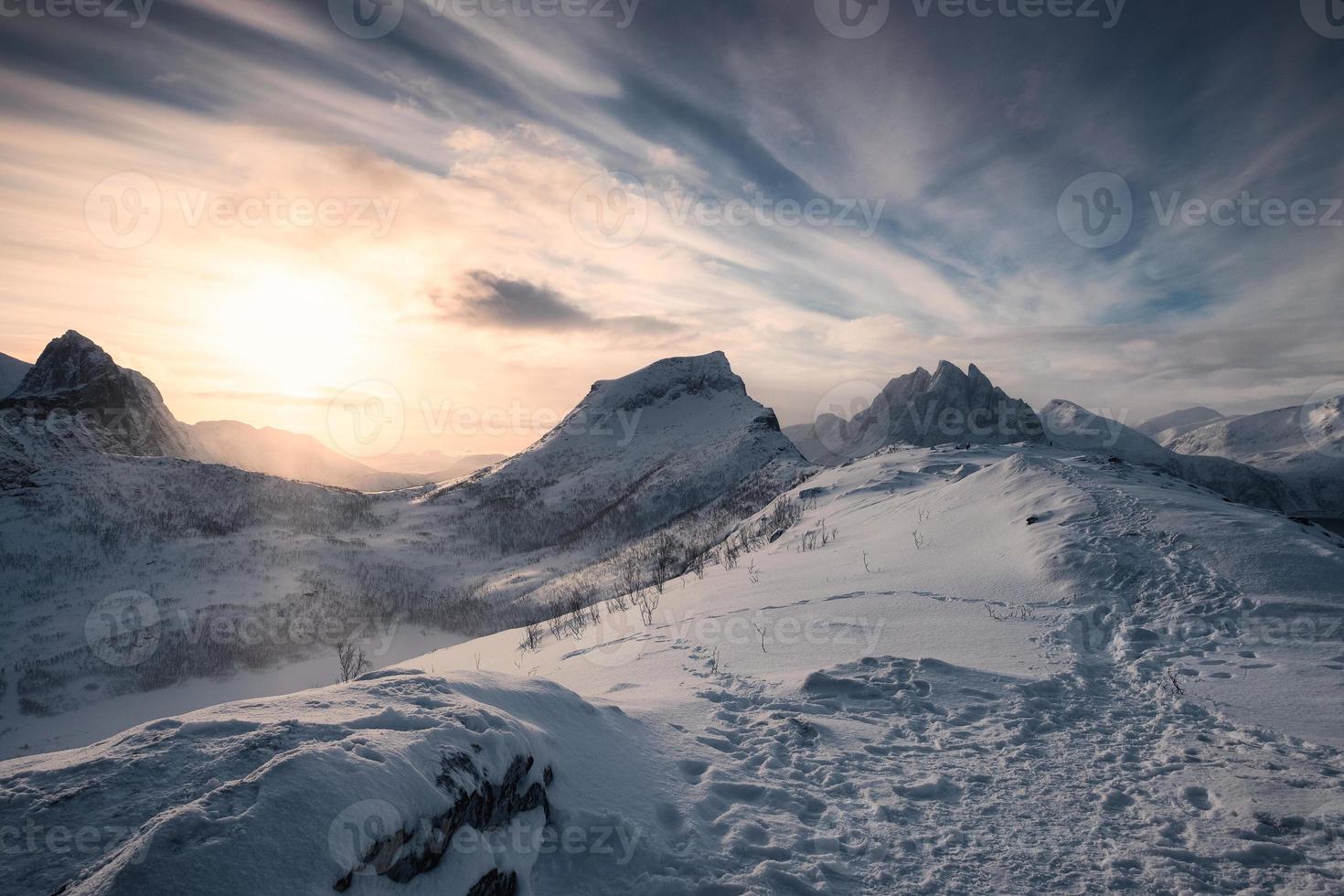 Sunrise over snowy mountains on Segla peak at Senja island photo