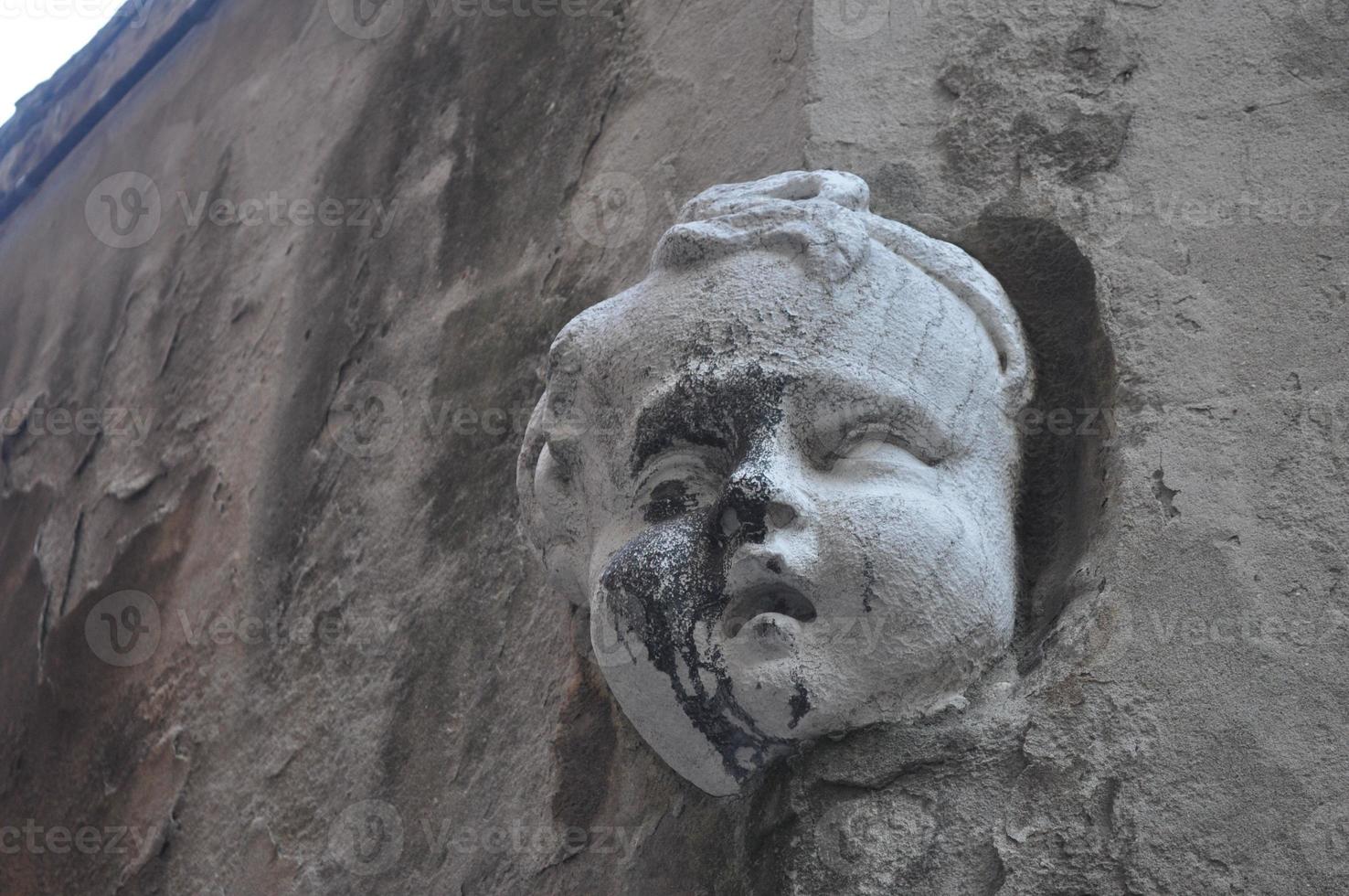 Ancient mask in Venice, Italy photo