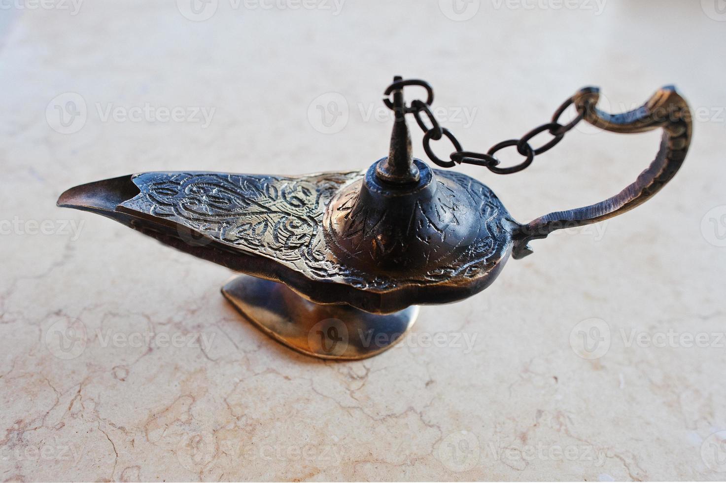 Aladdin oil lamp east design with egypt texture photo