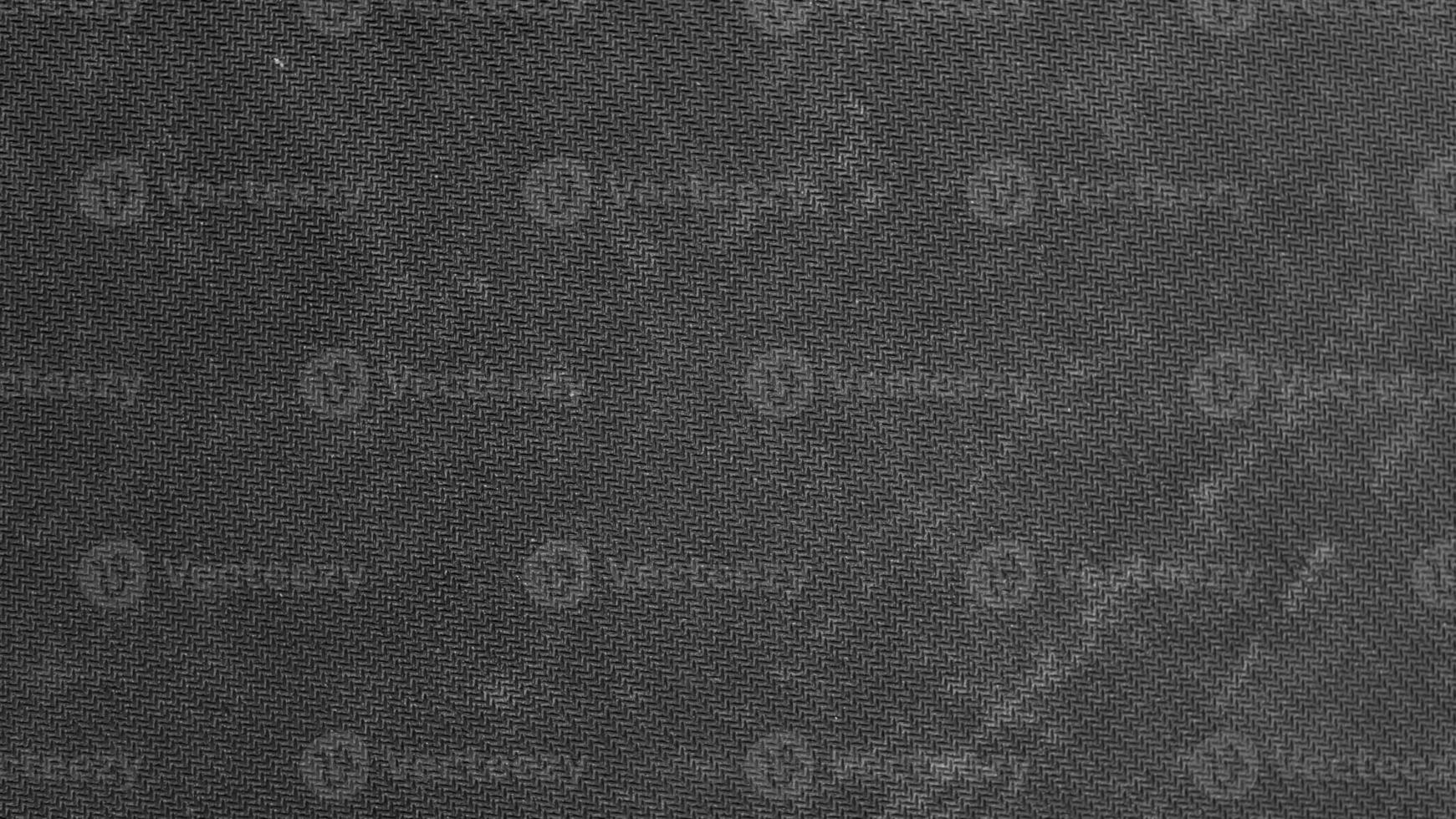 solid dark gray fabric texture background with copy space for image or text. Black canvas abstract photo