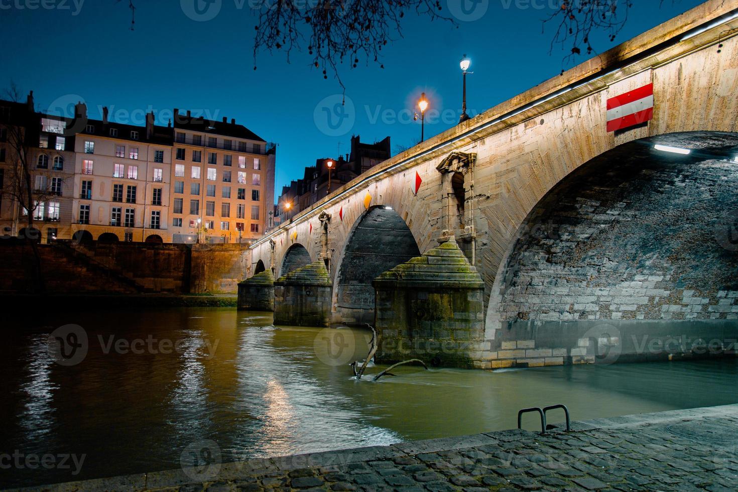 Twilight scene from Paris Seine River with fantastic colors during sunset. photo