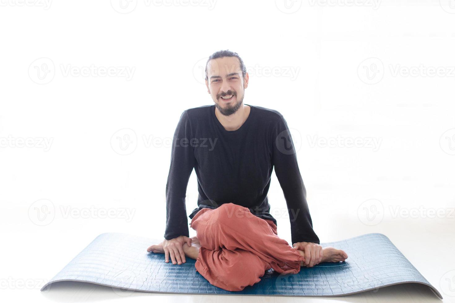 Man in peace with calm mood in meditation trance. Includes copy space, interior shot with professional performer. photo