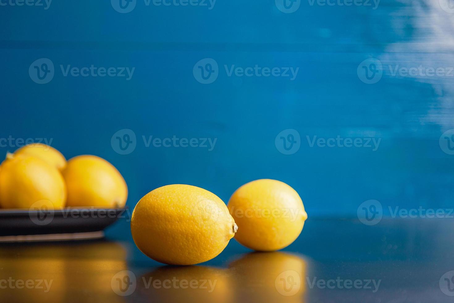 Moody styled pears view over rustic blue background with copy space. photo