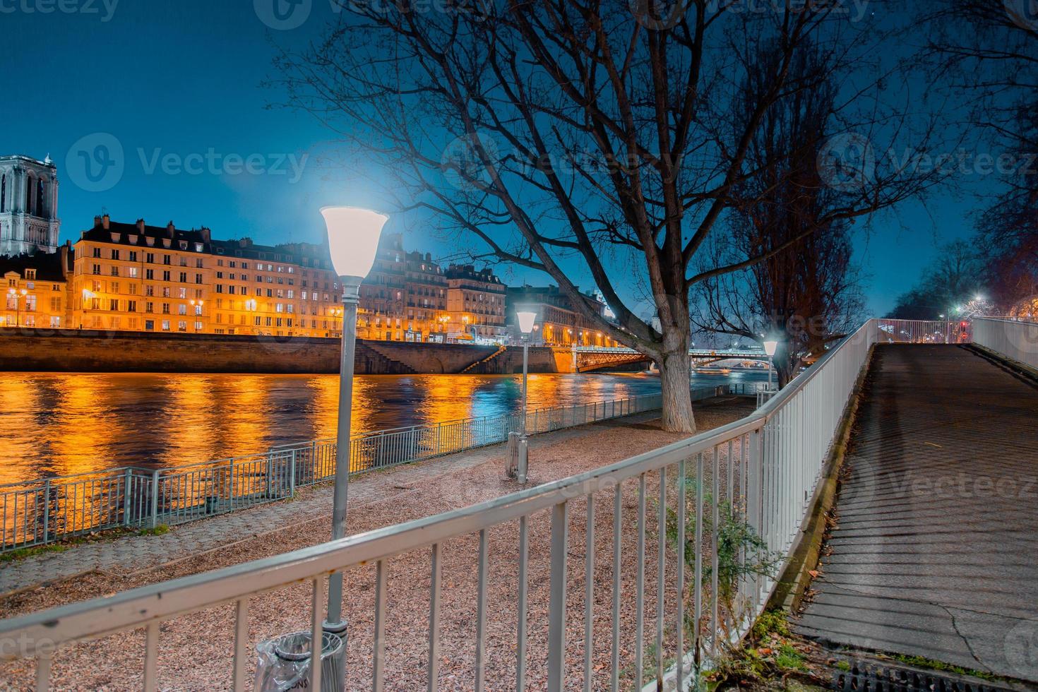 Twilight scene from Paris Seine River with fantastic colors during sunset. photo