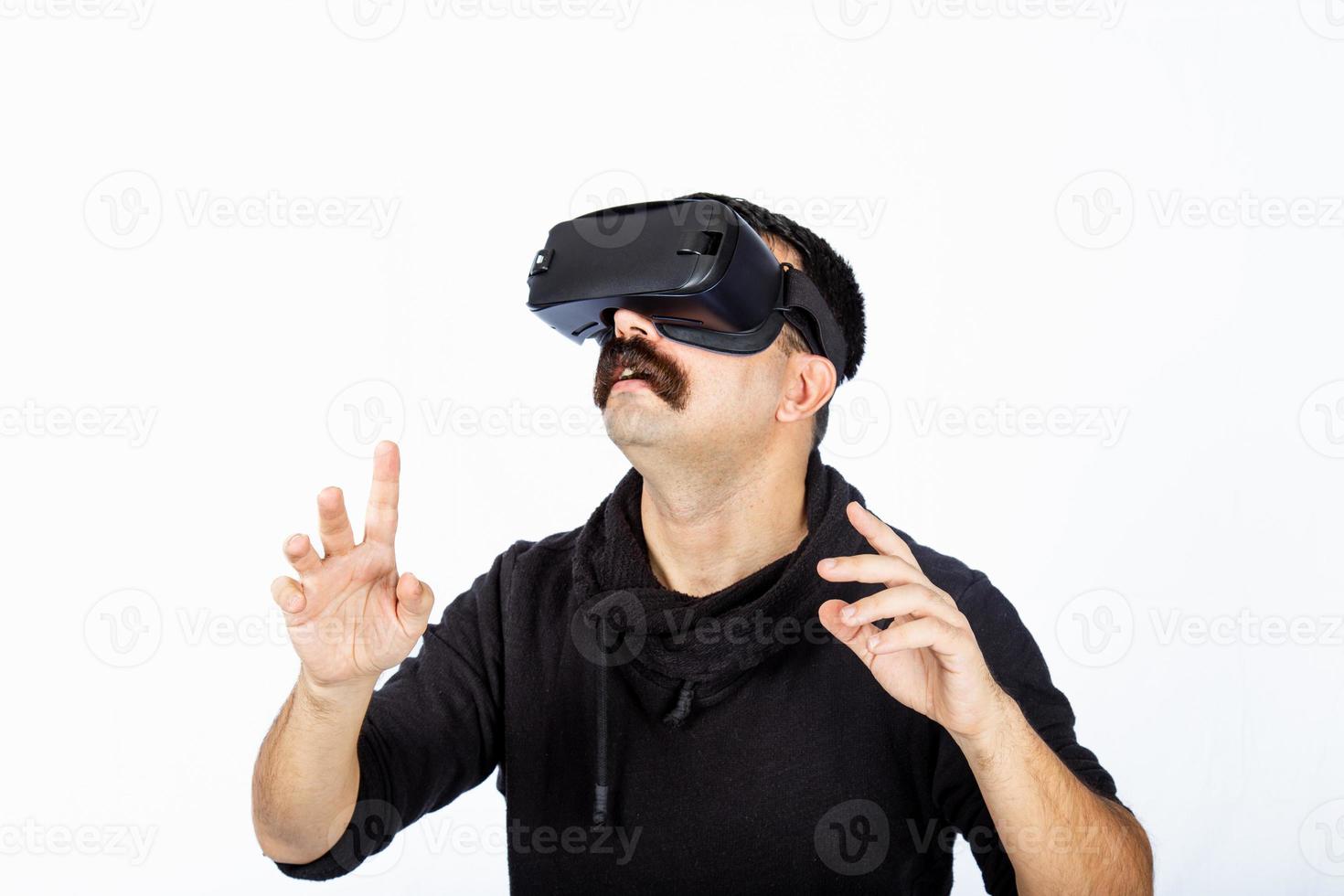 Man is pointing the space and shocking cyber realm during virtual reality experience. photo