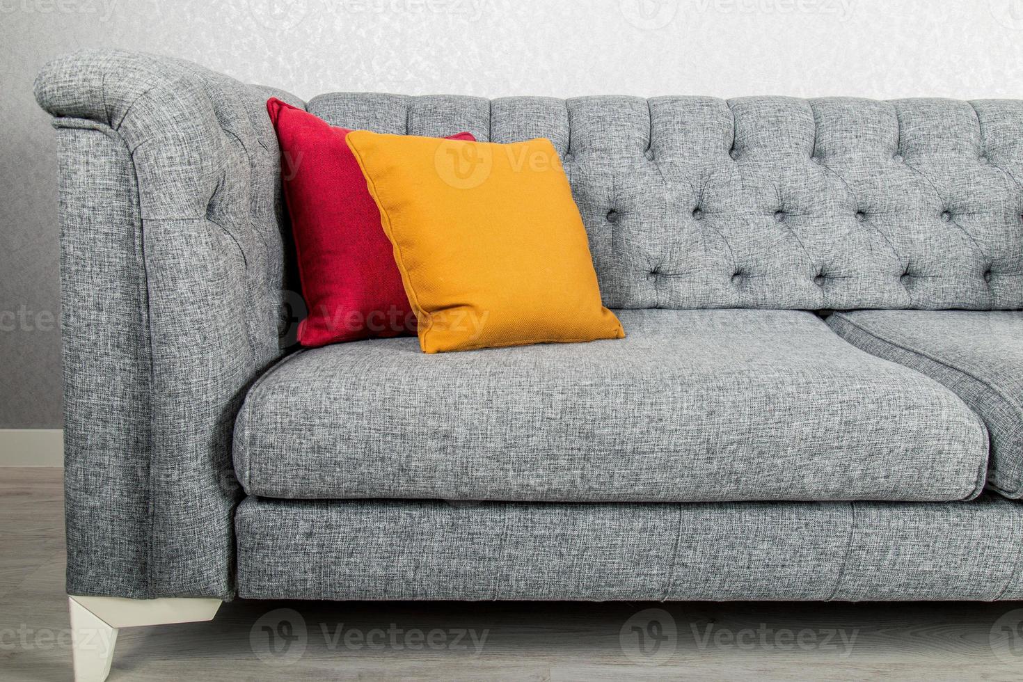 Elegant and trendy view of country styled sofa with colorful pillows photo