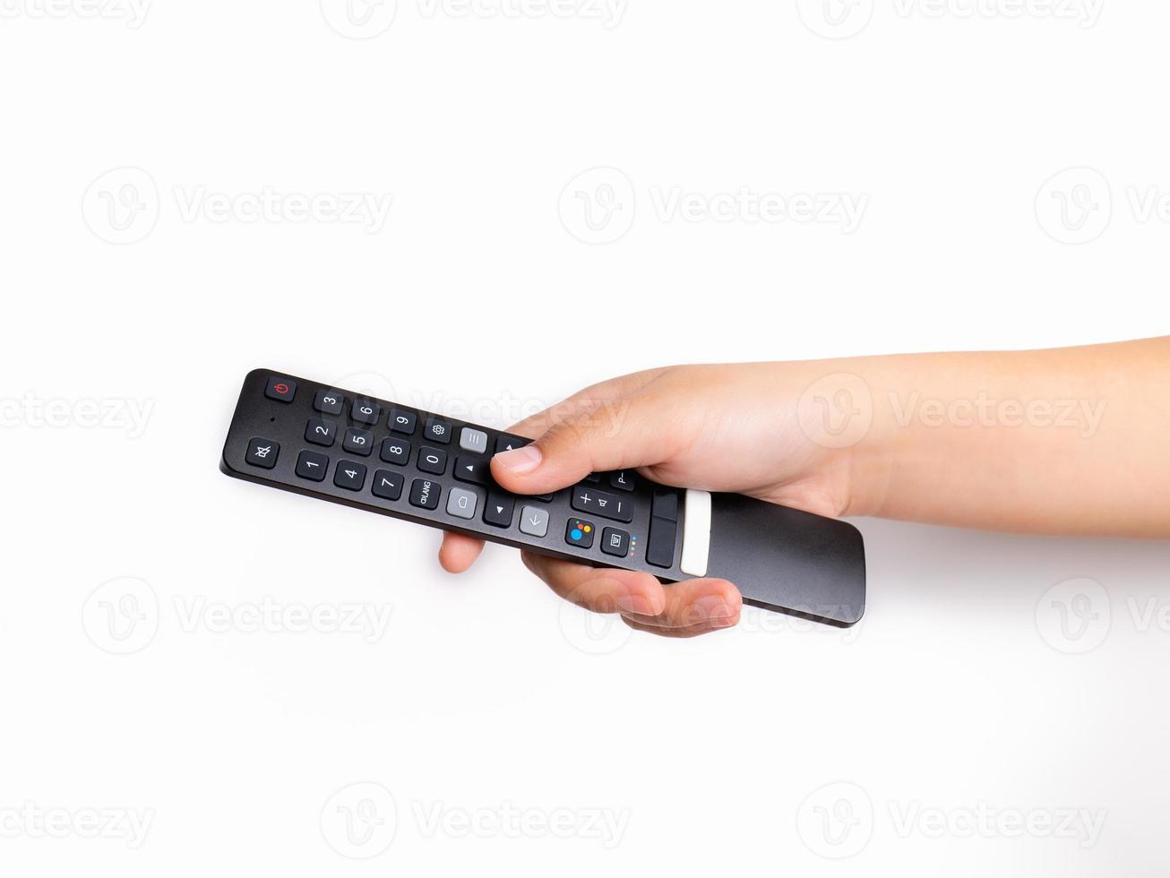 Use your hands to press the remote control. TV with buttons To watch live sports or TV series and various entertainment programs in your spare time family vacation It's a good family activity. photo