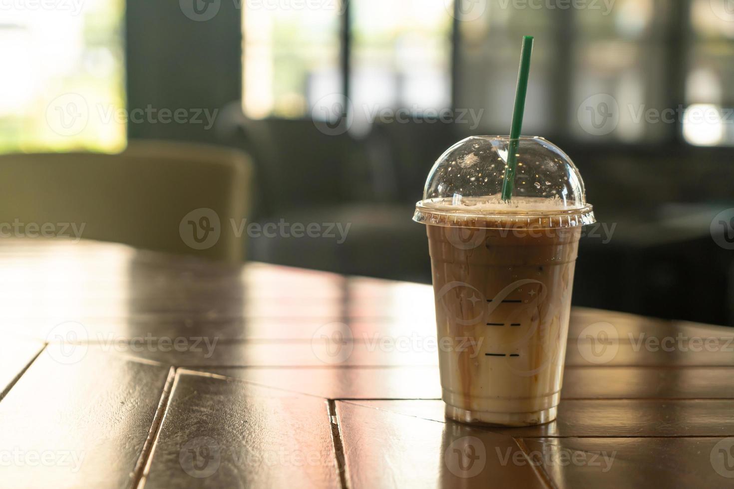 caramel macchiato coffee cup in coffee shop photo