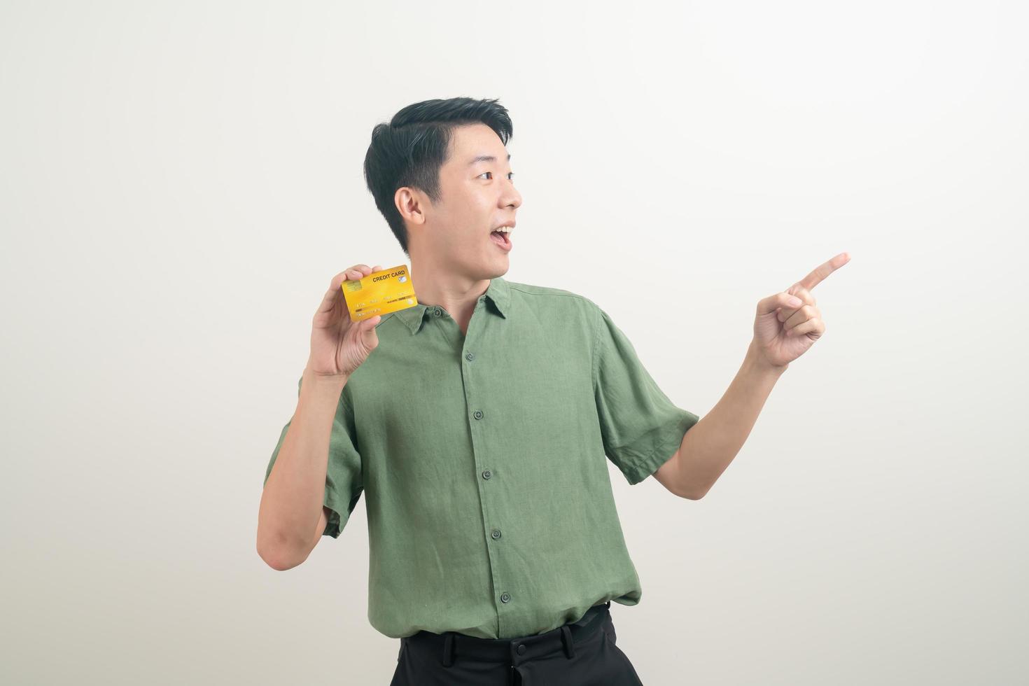 young Asian man holding credit card photo