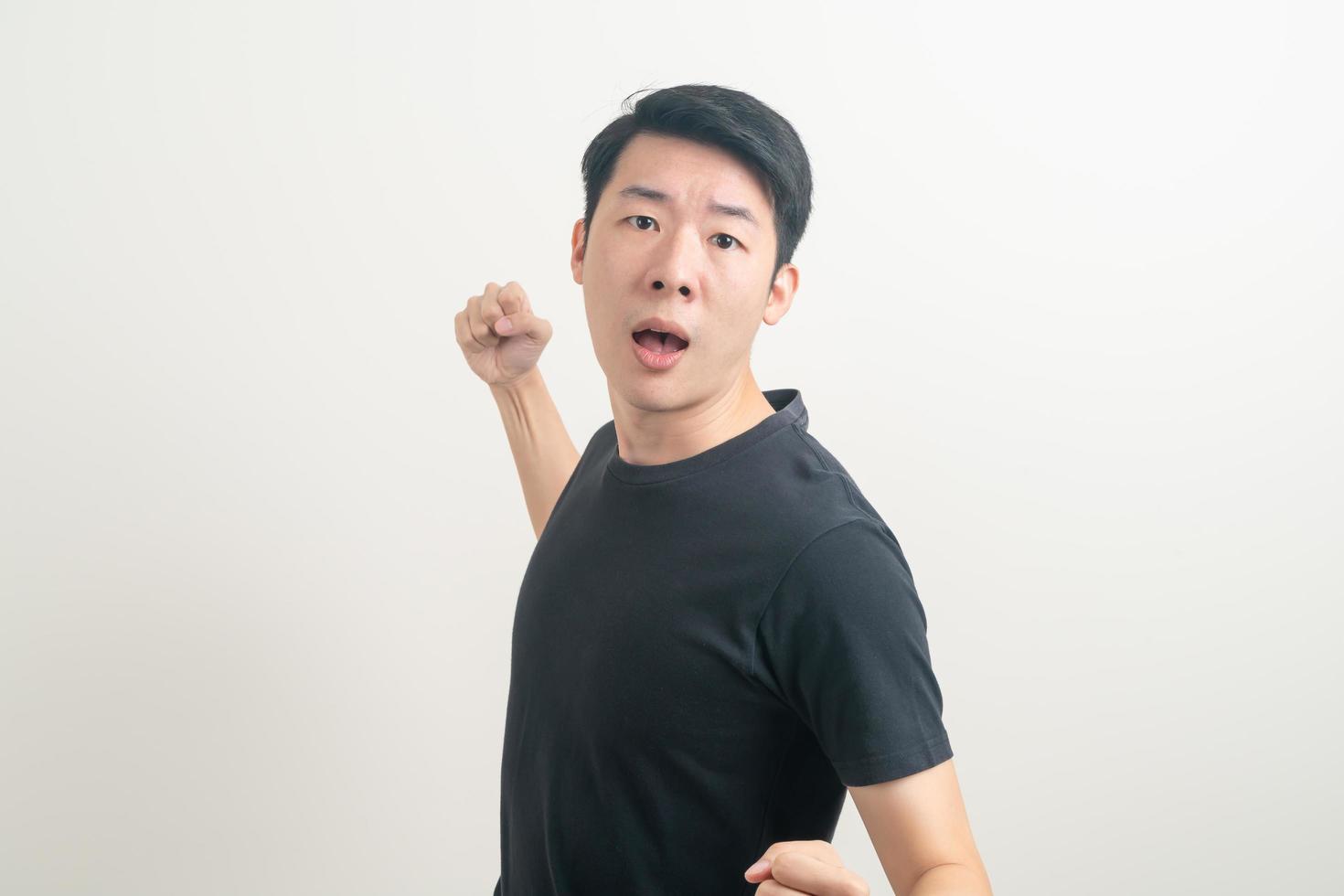 young Asian man with punching hand photo