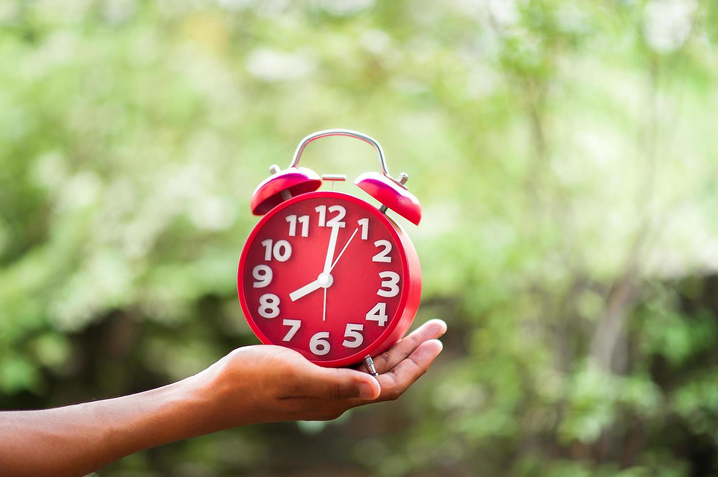 Hands and red clocks 6612381 Stock Photo at Vecteezy