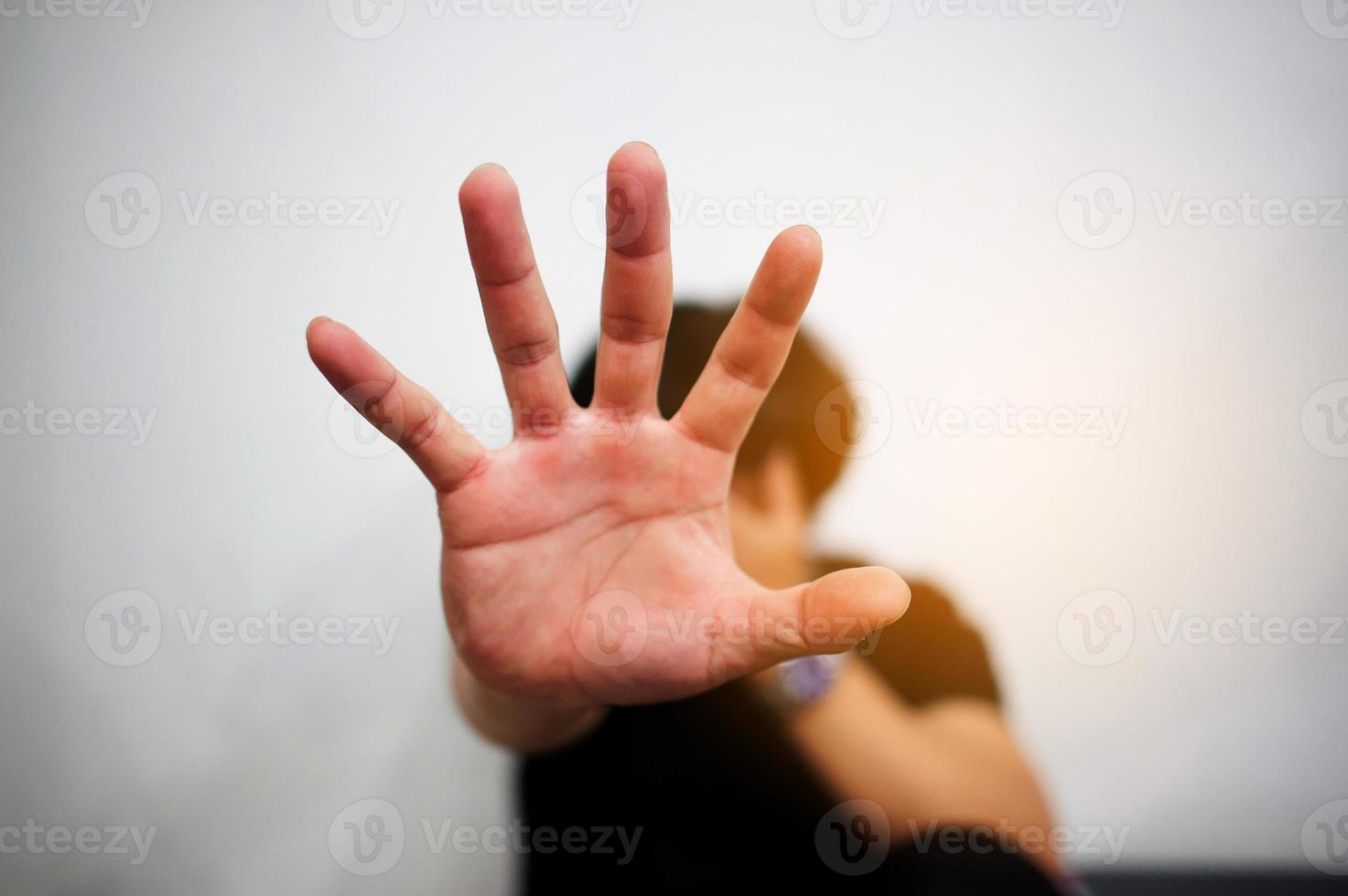 Man showing stop gesture photo