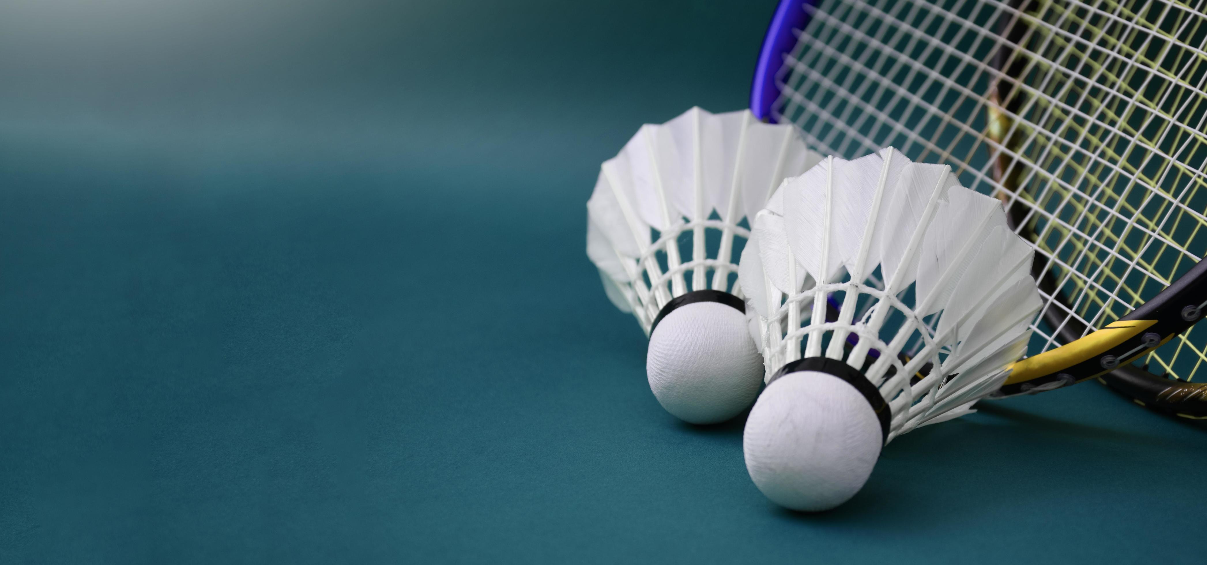Cream white badminton shuttlecock and racket with neon light shading on