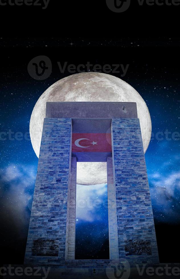 View of canakkale Martyrs' Monument with the moon at night. Background night sky with stars, moon and clouds. 18 March Canakkale Martyrs Monument. Modern and ready share and memorial design. photo