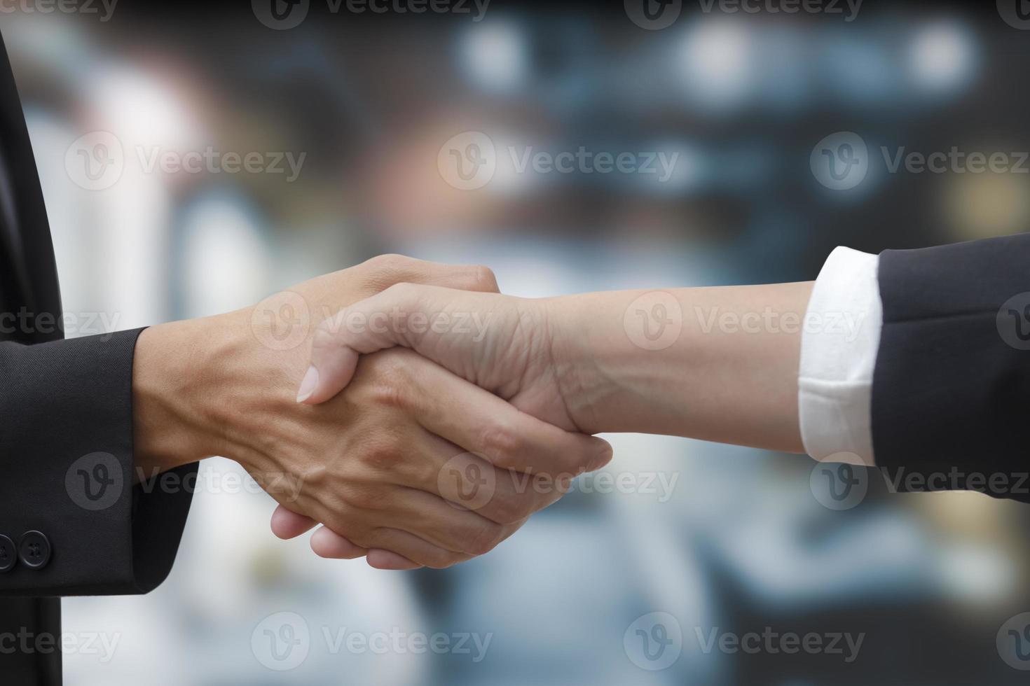 Double exposure of business Partner handshake between a man and a woman on blue sky background, business deal, handshake on modern blue background, Teamwork,support. Solidarity, compassion, photo