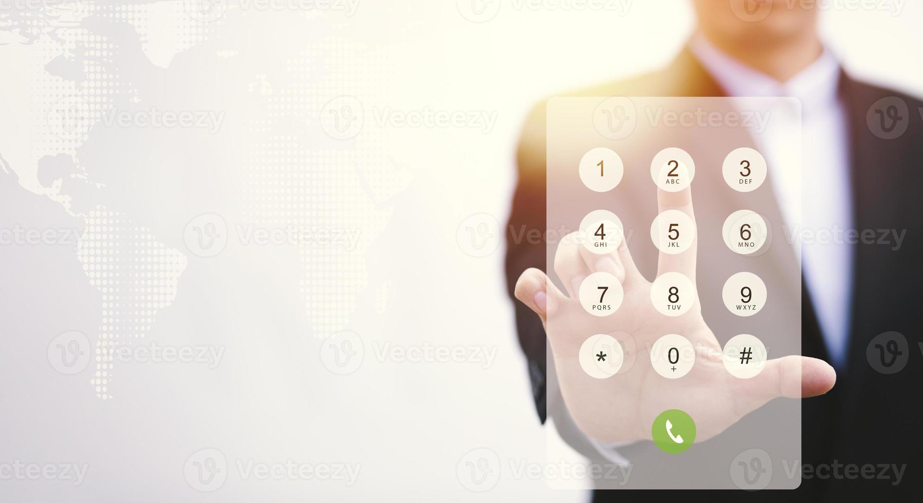 Dialing on virtual telephone keypad with transparent telephone buttons, businessman touch button of telephone number on screen, Finger touch number on smartphone to make a call, close up, photo