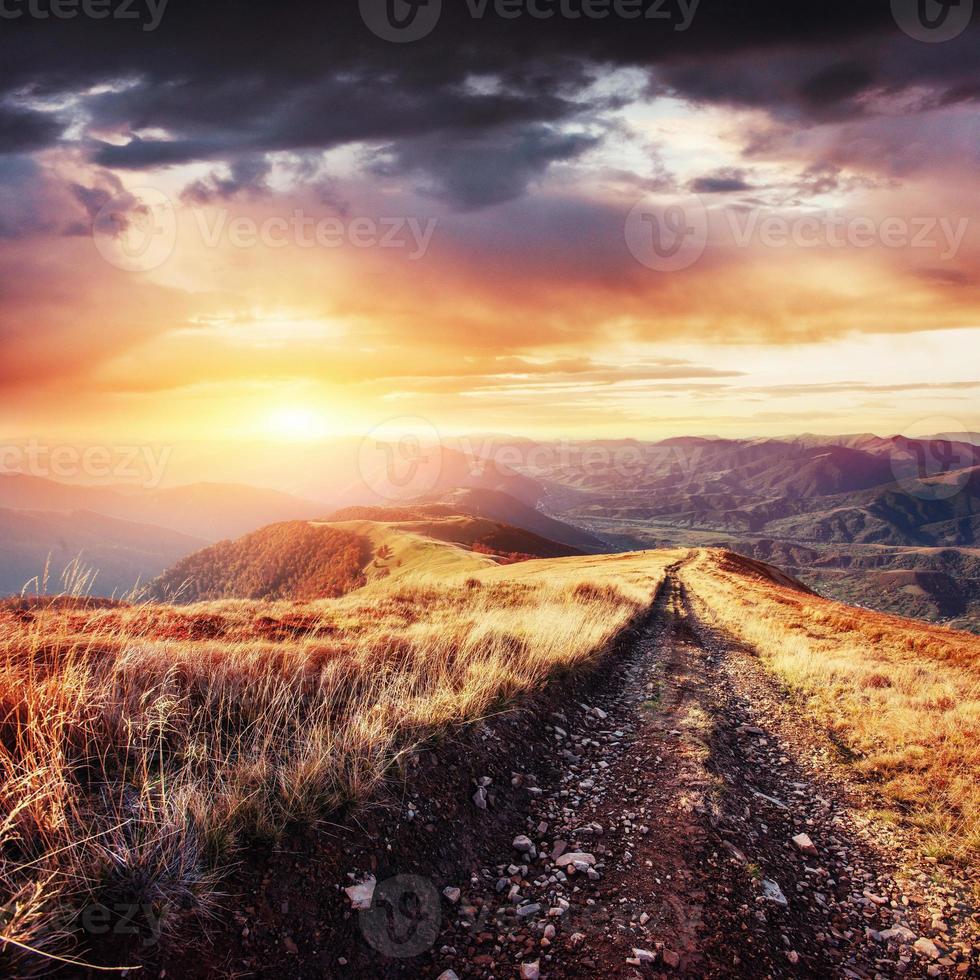 the winter road. Dramatic scene. Fantastic sunset photo