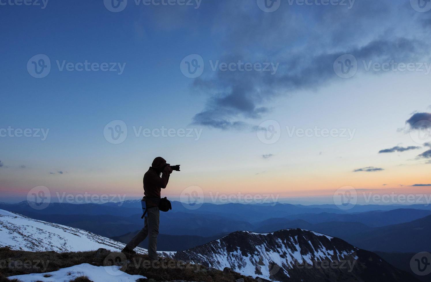 tourist looks at the landscape. Beautiful sunset photo