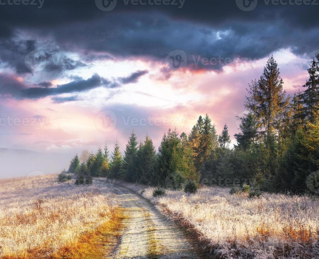 October mountain range in the first winter days. Road to hoarfro photo