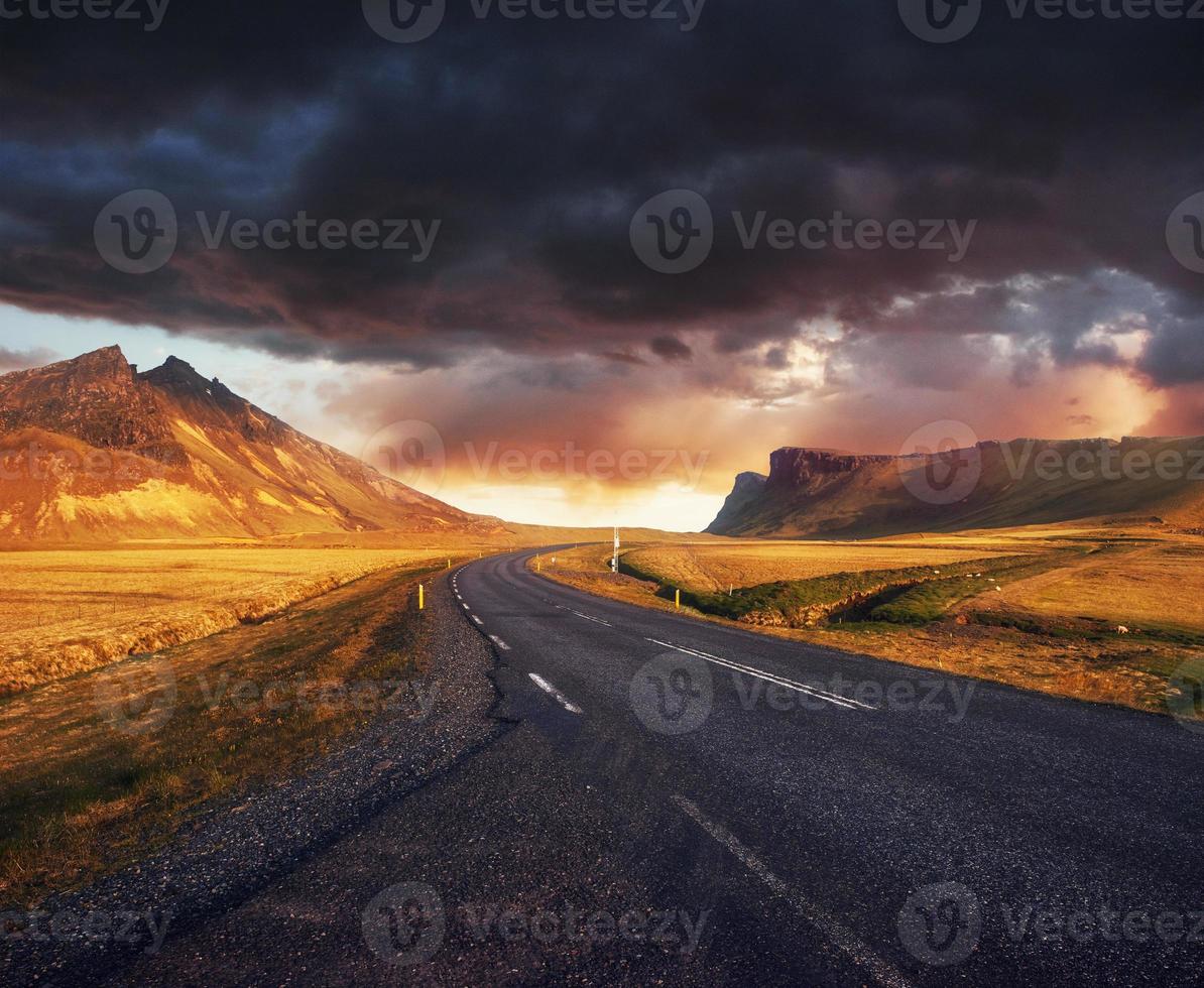 Road in mountains. Fantastic autumn landscape. Bridge over a cha photo