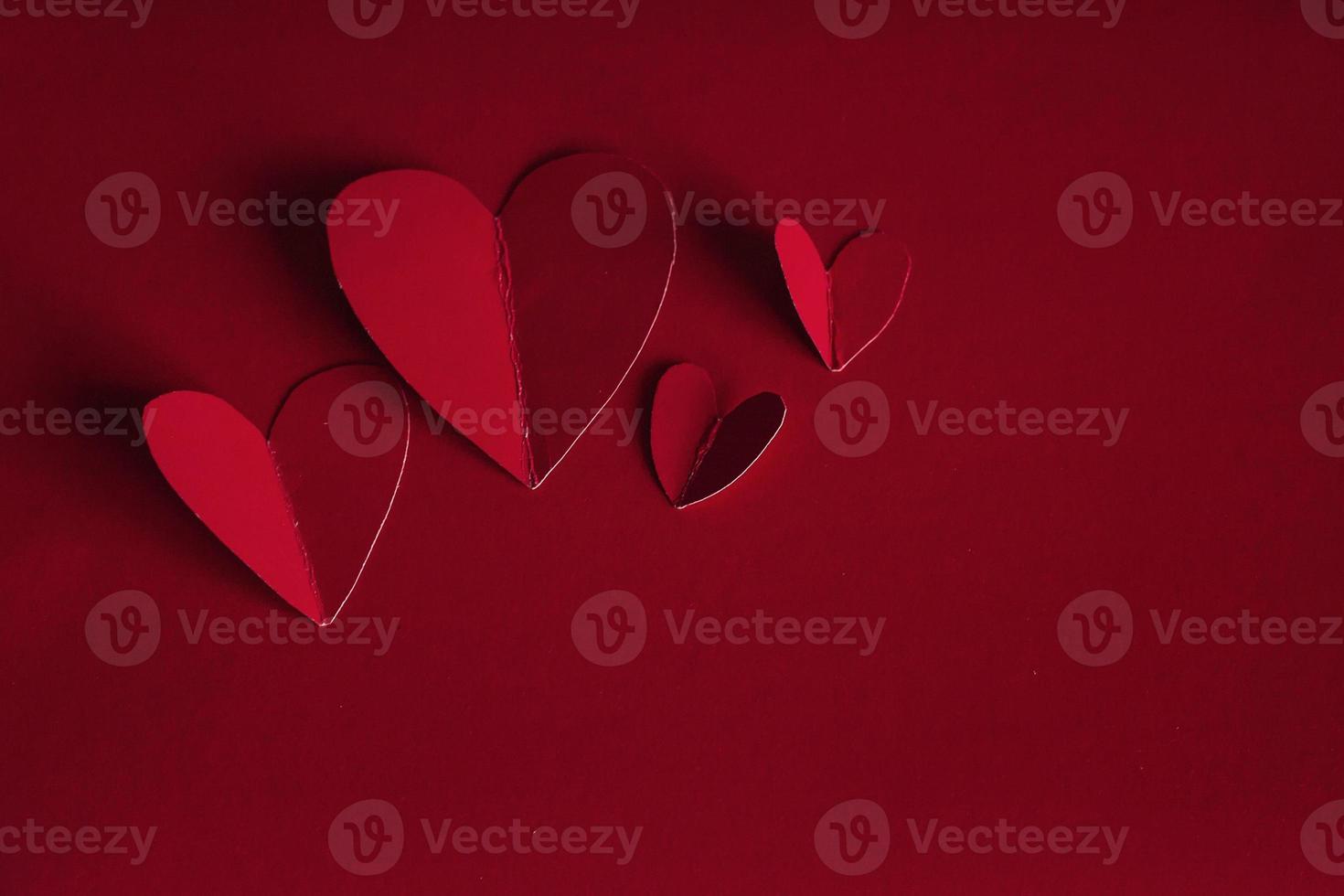 Holiday Card. Heart for Valentines day. Red hearts on a  back photo