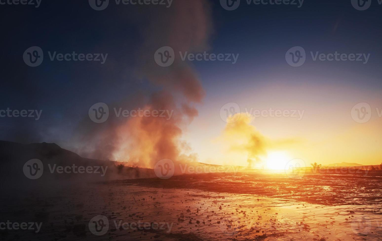 Fantastic sunset Strokkur geyser eruption in Iceland photo