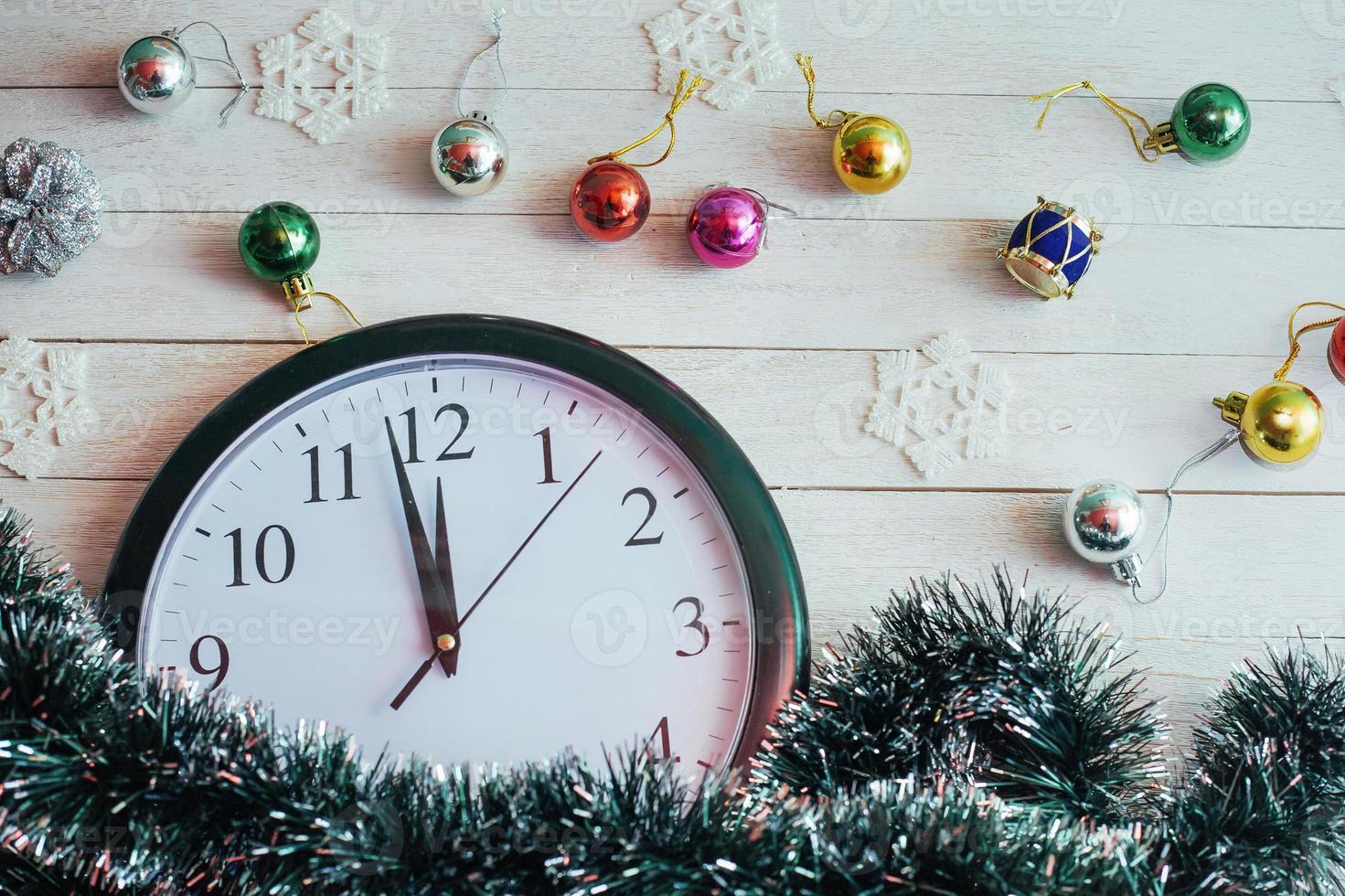 New Year Midnight - clock on background wooden photo