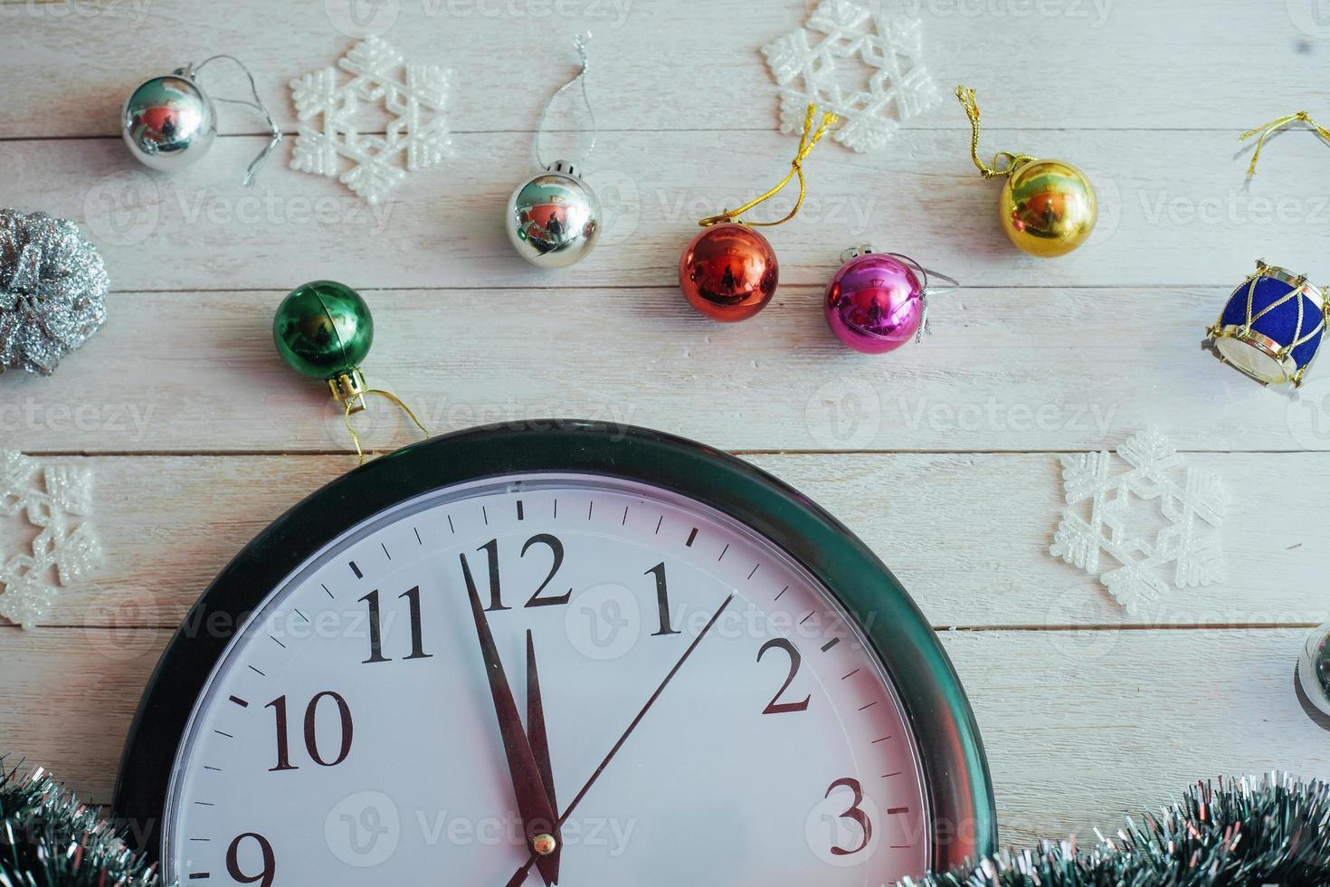 New Year Midnight - clock on background wooden photo