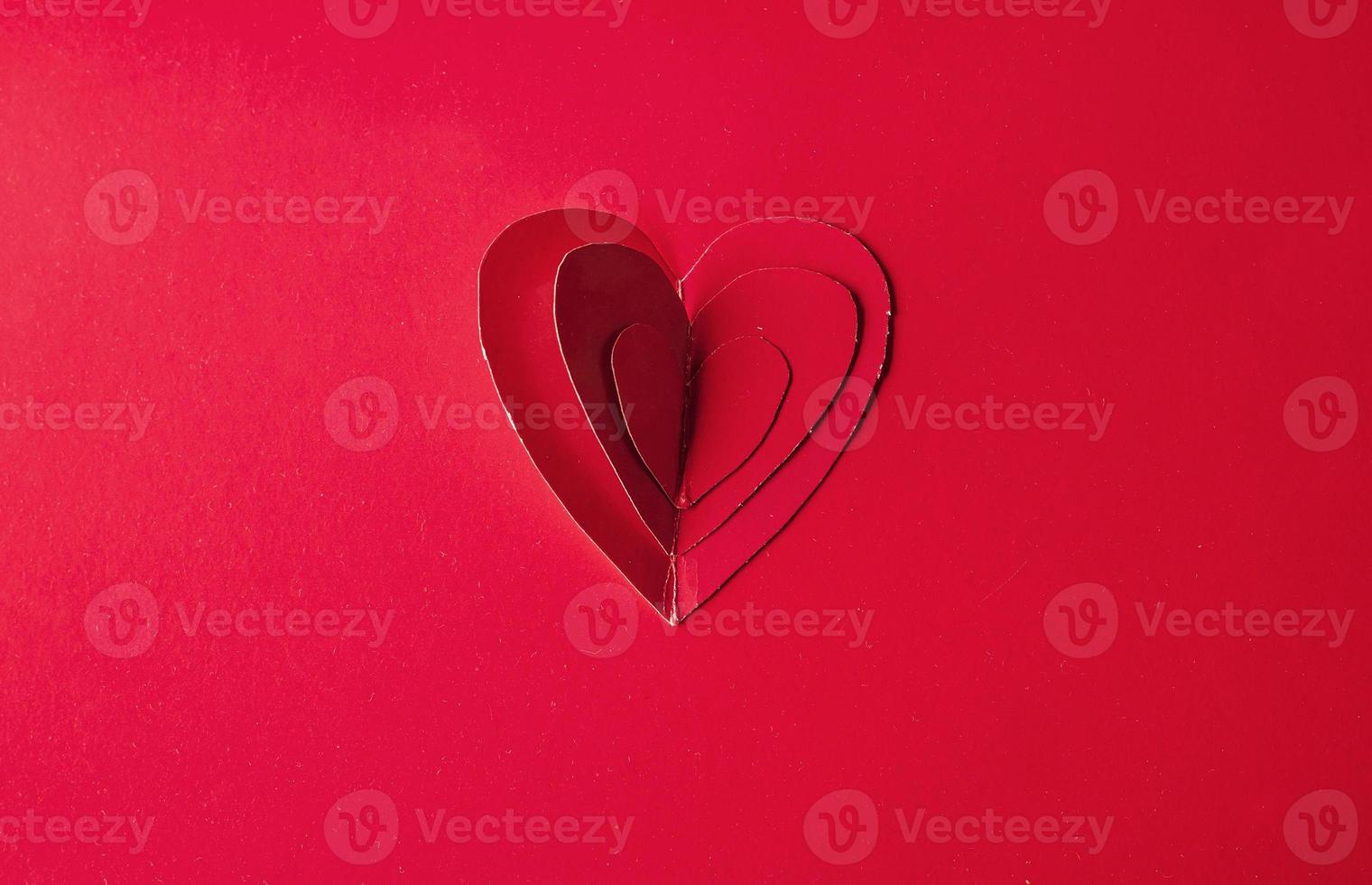 Holiday Card. Heart for Valentines day. Red hearts on a  back photo