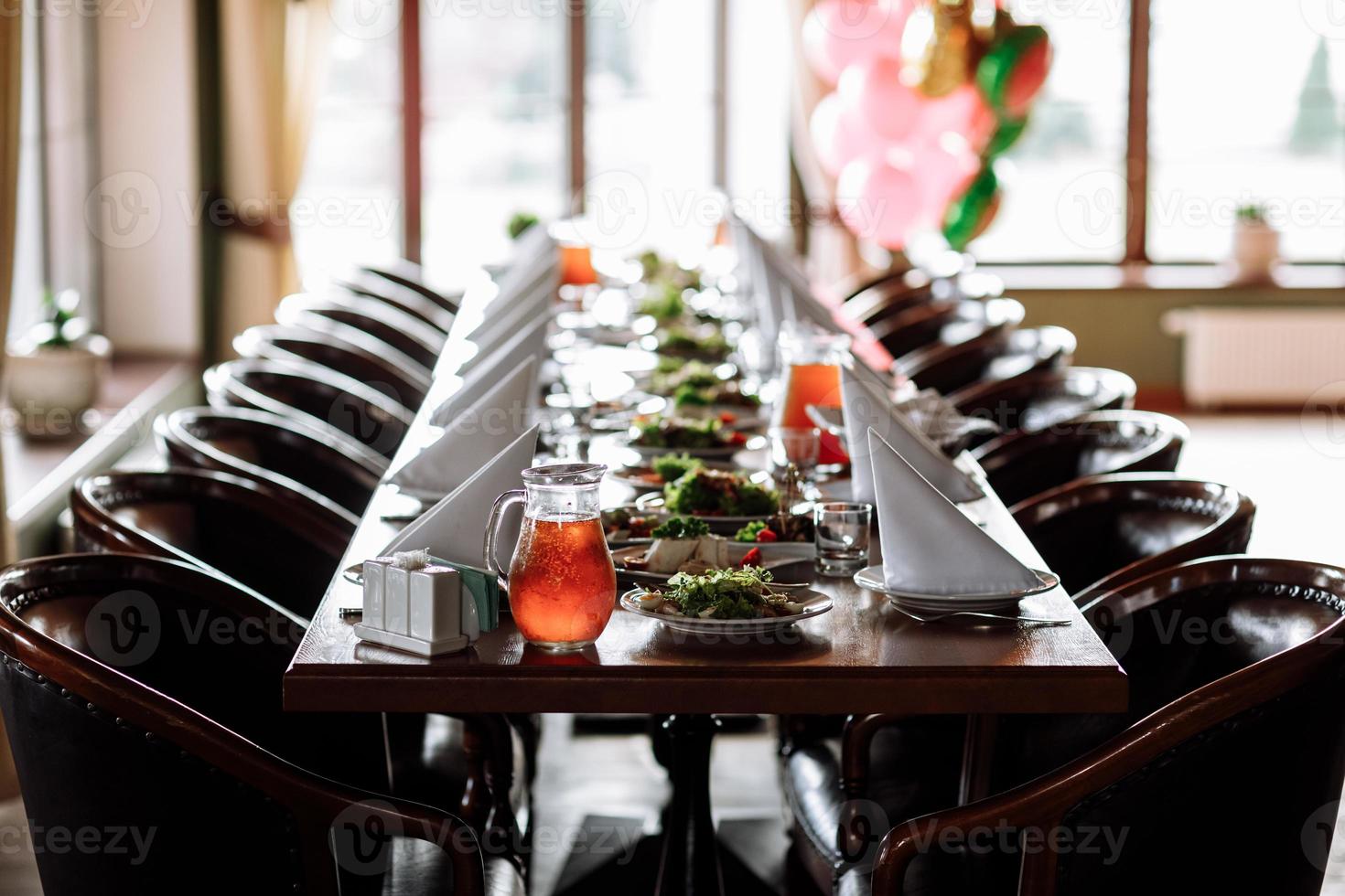 Beautiful table set for an event party or wedding reception . restaurant interior photo