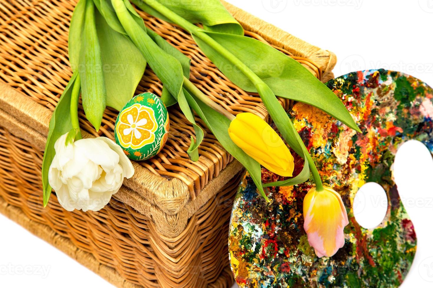 Easter eggs and tulips. Easter eggs with tulips on a white background, easter holiday concept. photo