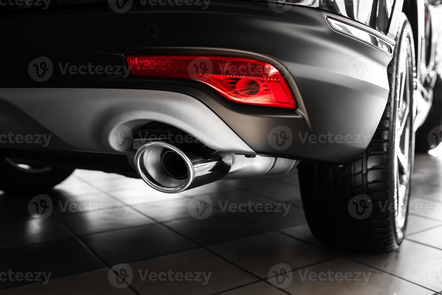 car exhaust pipe. Exhaust pipe of a luxury car. details of stylish car interior, leather interior. Close up photo