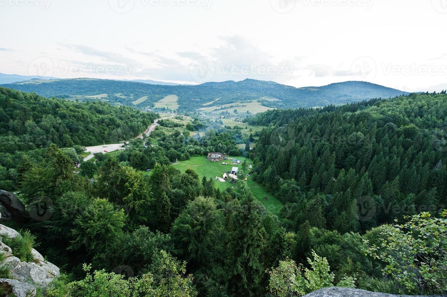 Tustan fortress ruins of rocks at Carpathian Ukraine. View on camping village photo