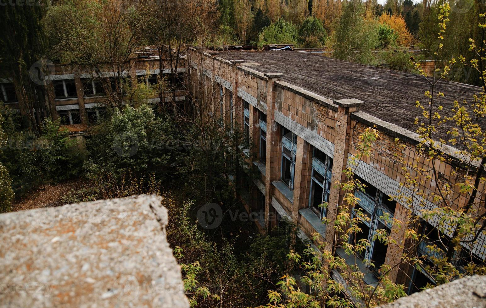 Chernobyl exclusion zone with ruins of abandoned pripyat city zone of radioactivity ghost town. photo