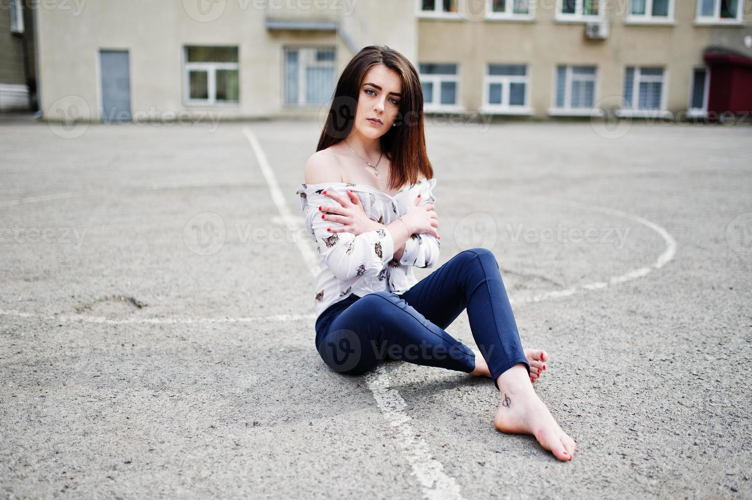 Young stylish brunette girl on shirt, pants and high heels shoes, posed  background iron fence. Street fashion model concept. 6631559 Stock Photo at  Vecteezy