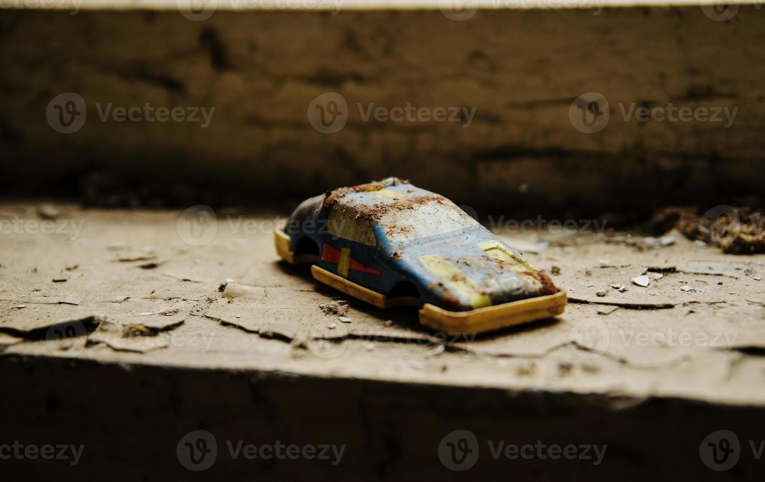 Soviet toys of rusty car in Chernobyl nuclear disaster area. photo